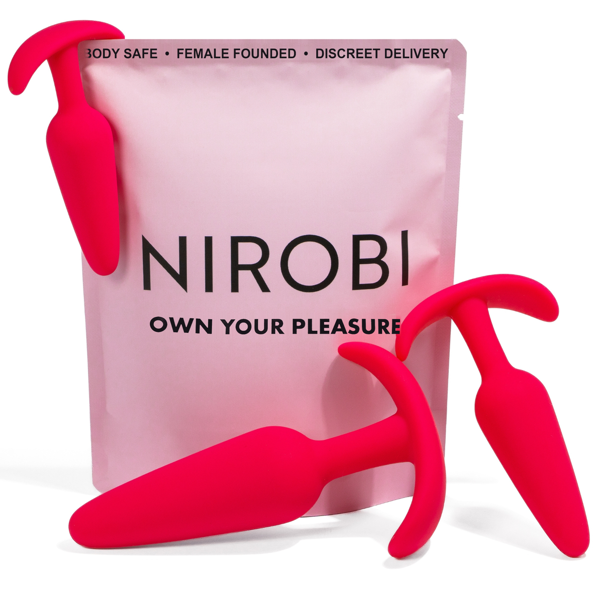 Three red Nirobi butt plugs displayed with a pink pouch featuring black lettering.